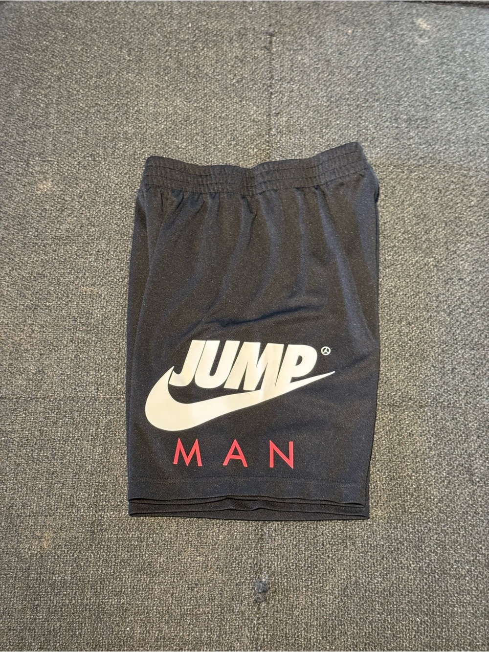 Nike Jump Man Black Athletic Shorts with White Logo and Red Lettering